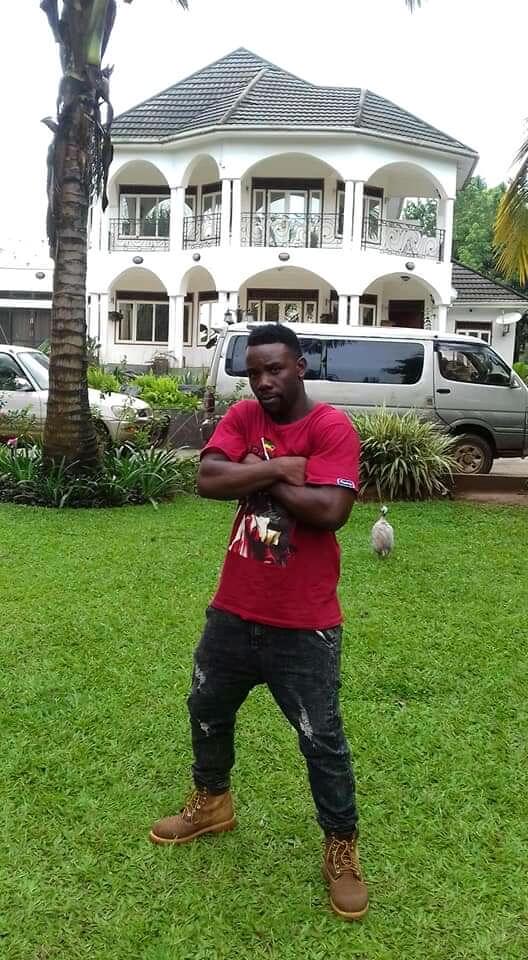 Walugembe poses for a photo at Bobi Wine's mansion