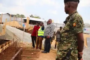 Col. Katabazi, the Teso College Headteacher, and other guests visited the site where a state-of-the-art semi-Olympic swimming pool is being constructed.